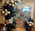 Custom black & silver balloons with silver shimmer wall backdrop