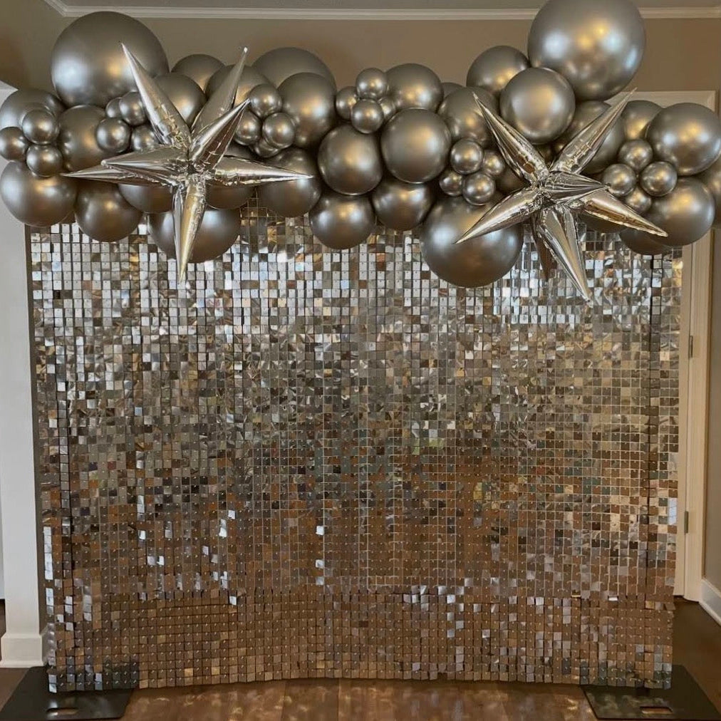 Custom black & silver balloons with silver shimmer wall backdrop