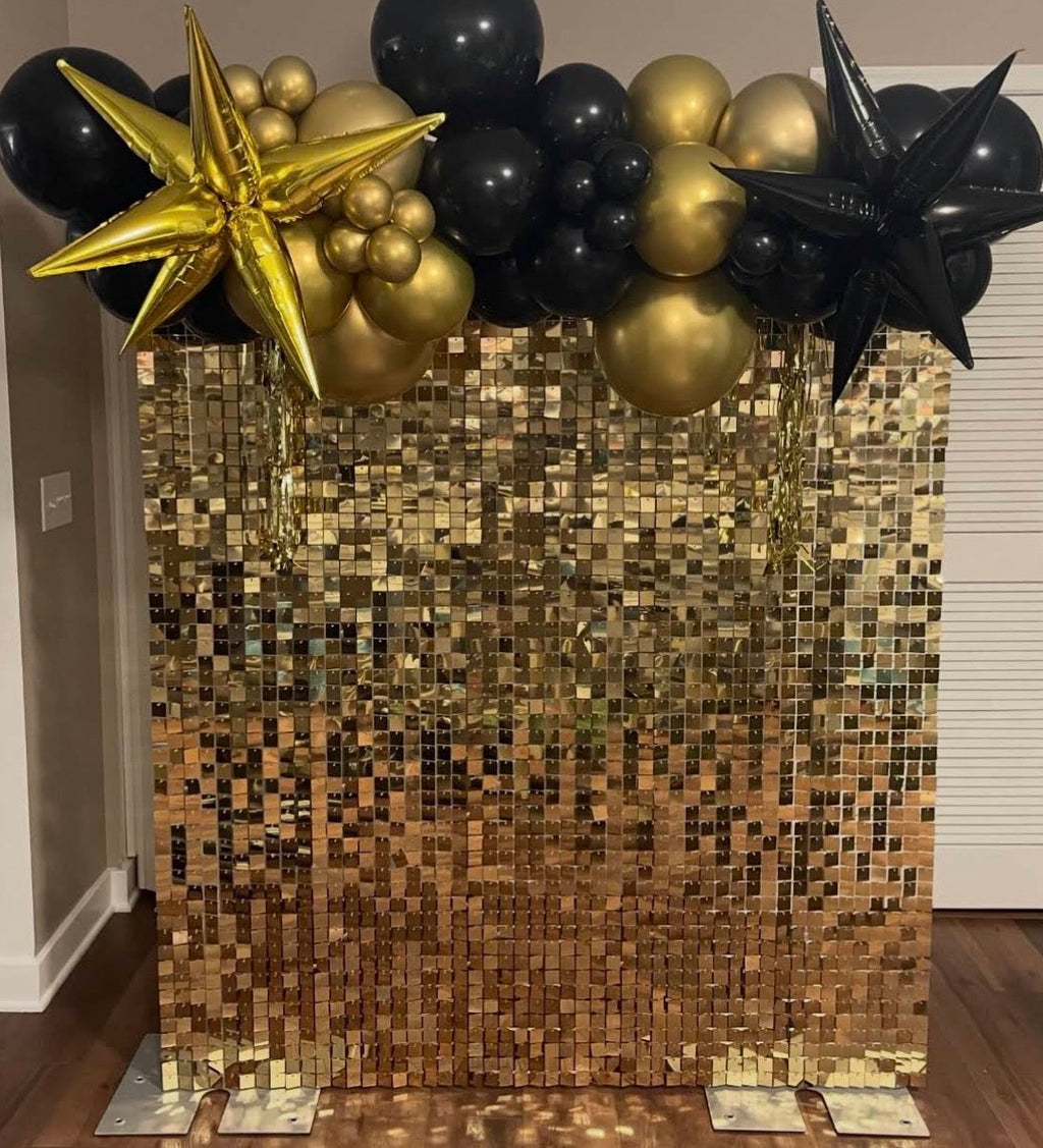 Custom black & silver balloons with silver shimmer wall backdrop